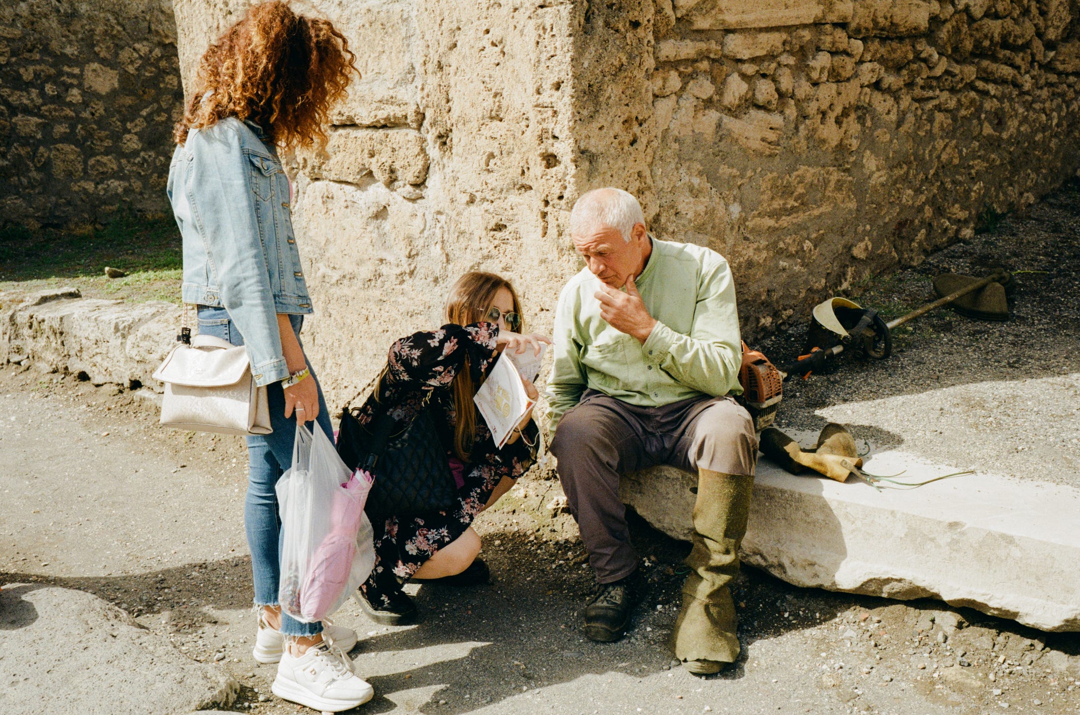 A woman asks for directions in Pompeii. Sept 2022